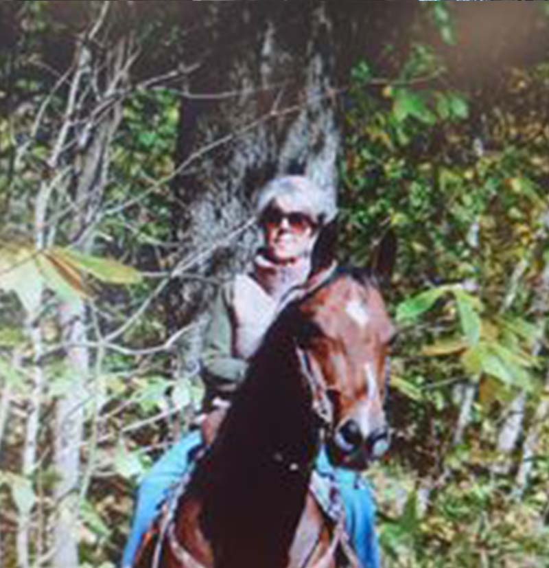 Andie - Andie Smiling and Riding a Horse with Sunglasses On