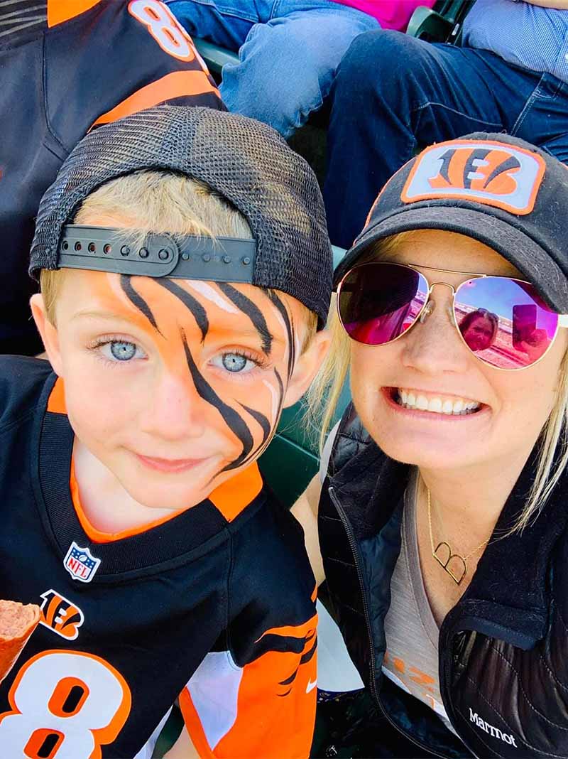 Blair - Blair and Son with Face Paint on Smiling and Taking a Selfie at a Football Game