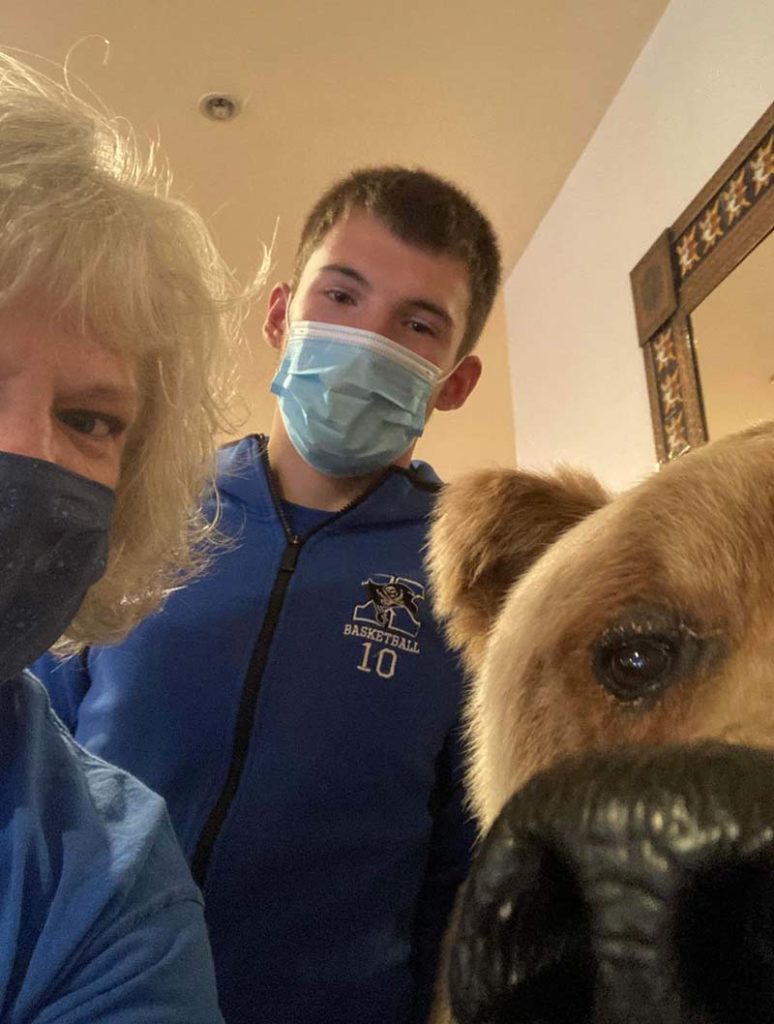 Susan - Susan Taking a Selfie with a Boy and a Dog in a House